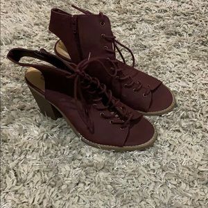 Maroon lace up heels, back of the heel open.